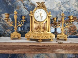 A Tiffany three piece antique mantel clock set